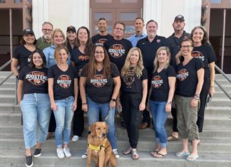 TIGER BOOSTERS are Back in Action at SPHS PHOTO: provided by SPHS Booster Club | The South Pasadenan | SPHS Booster Club board members: Bottom Row L-R: Stephanie Burchardt, Megan Gardner, Toby Bangar (with Ember), Nichole Dunville, Kristin Wingard, Kristen Swift Middle Row L-R: Aman Thind, Rachel Fox, Jill Olsen, David Zeiger, Eric Chabot, Amy Davis Jones Top Row L-R: Bill Buckley, Val Huntley, Dan Wakumoto, Principal John Eldred, Interim Athletic Director CB Richards