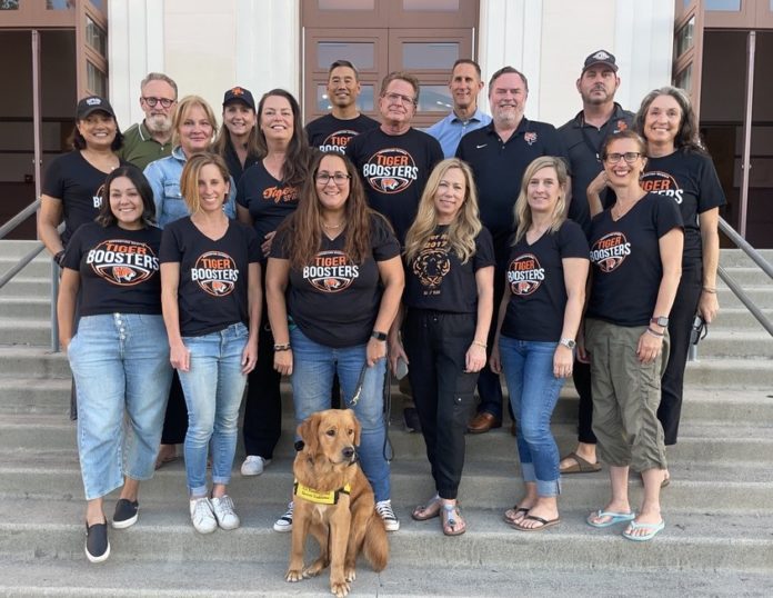 PHOTO: provided by SPHS Booster Club | The South Pasadenan | SPHS Booster Club board members: Bottom Row L-R: Stephanie Burchardt, Megan Gardner, Toby Bangar (with Ember), Nichole Dunville, Kristin Wingard, Kristen Swift Middle Row L-R: Aman Thind, Rachel Fox, Jill Olsen, David Zeiger, Eric Chabot, Amy Davis Jones Top Row L-R: Bill Buckley, Val Huntley, Dan Wakumoto, Principal John Eldred, Interim Athletic Director CB Richards