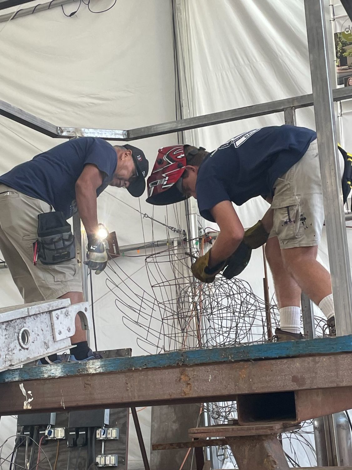 | The South Pasadenan | South Pasadena News PHOTO: Sally Kilby | The South Pasadenan | Volunteer construction crew members (left to right) Dave Martinez and Jeremy Bruce build the platform for the elephant that will appear with other animals on the “Boogie Fever” float at the Sept. 23 workday.