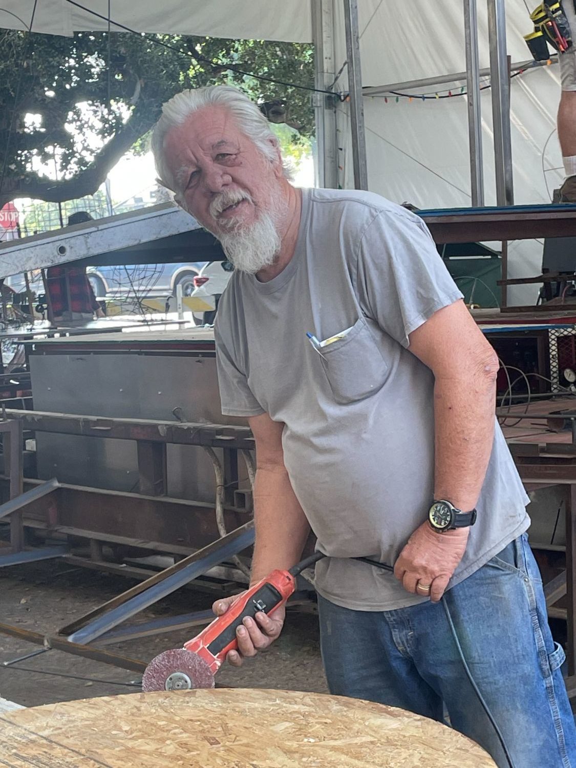 | The South Pasadenan | South Pasadena News PHOTO: Sally Kilby | The South Pasadenan | Construction crew member Steve Fillingham sands the edges of a drum that will be played by an orangutang on the 2024 South Pasadena float.