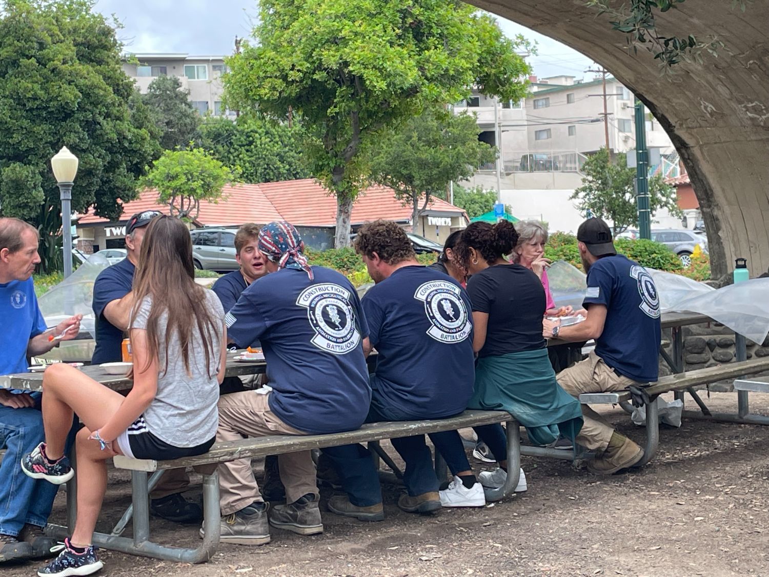 | The South Pasadenan | South Pasadena News PHOTO: provided by SPTOR | The South Pasadenan | Work crew at lunch under the Oaklawn Bridge at the War Memorial Building tent site.