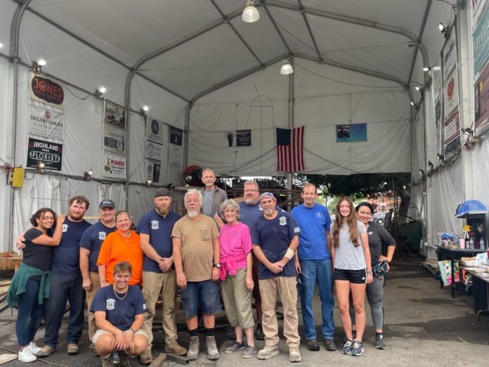PHOTO: provided by SPTOR | The South Pasadenan | Crew on a recent Saturday workday at the War Memorial Building float site consisted of (left to right) Alexandra Strong, Brandon Carlson, Rob Benjamin, Janet Benjamin, Jeremy Bruce (not standing), Bryce Quinn, Steve Fillingham, Kris Nagle, Sharon Mitchell, James Jontz, Brant Dunlap, Bill Hodson, Katlyn Hodson and Victoria Rea. Not pictured: Sandy Fielding.