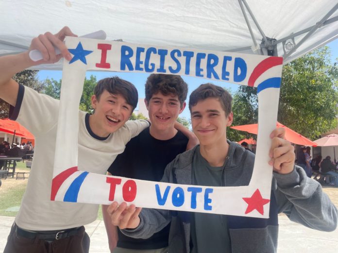 PHOTO: provided by South Pasadena High School | The South Pasadenan | SPHS students (left to right) Felix McFerrin, Sebastian Thompson, and Nathan Friezer share their enthusiasm about registering to vote.