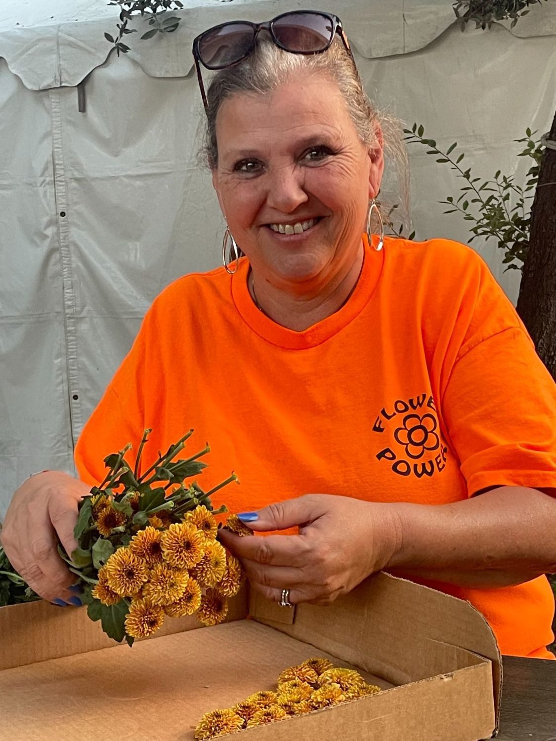 | The South Pasadenan | South Pasadena News PHOTO: Sally Kilby | The South Pasadenan | Decoration Chair Janet Benjamin demonstrates “popping mums” during the Oct. 10 float work session. The flower heads will be used in decorating the 2024 South Pasadena float.