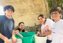 PHOTO: Sally Kilby | The South Pasadenan | Volunteers count vials for flowers Oct. 7 in order to determine how many more need to be ordered. Thousands of vials will be used on the float. L-R are Sebastian Adams, Mellany Becerra, Julia Lopez and Diego Adams.