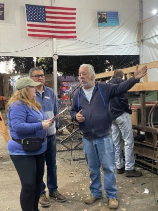 PHOTO: provided by SPTOR | The South Pasadenan | SPTOR Construction Chair Steve Fillingham shares South Pasadena&rsquo;s float construction progress with Tournament of Roses Float Liaisons.