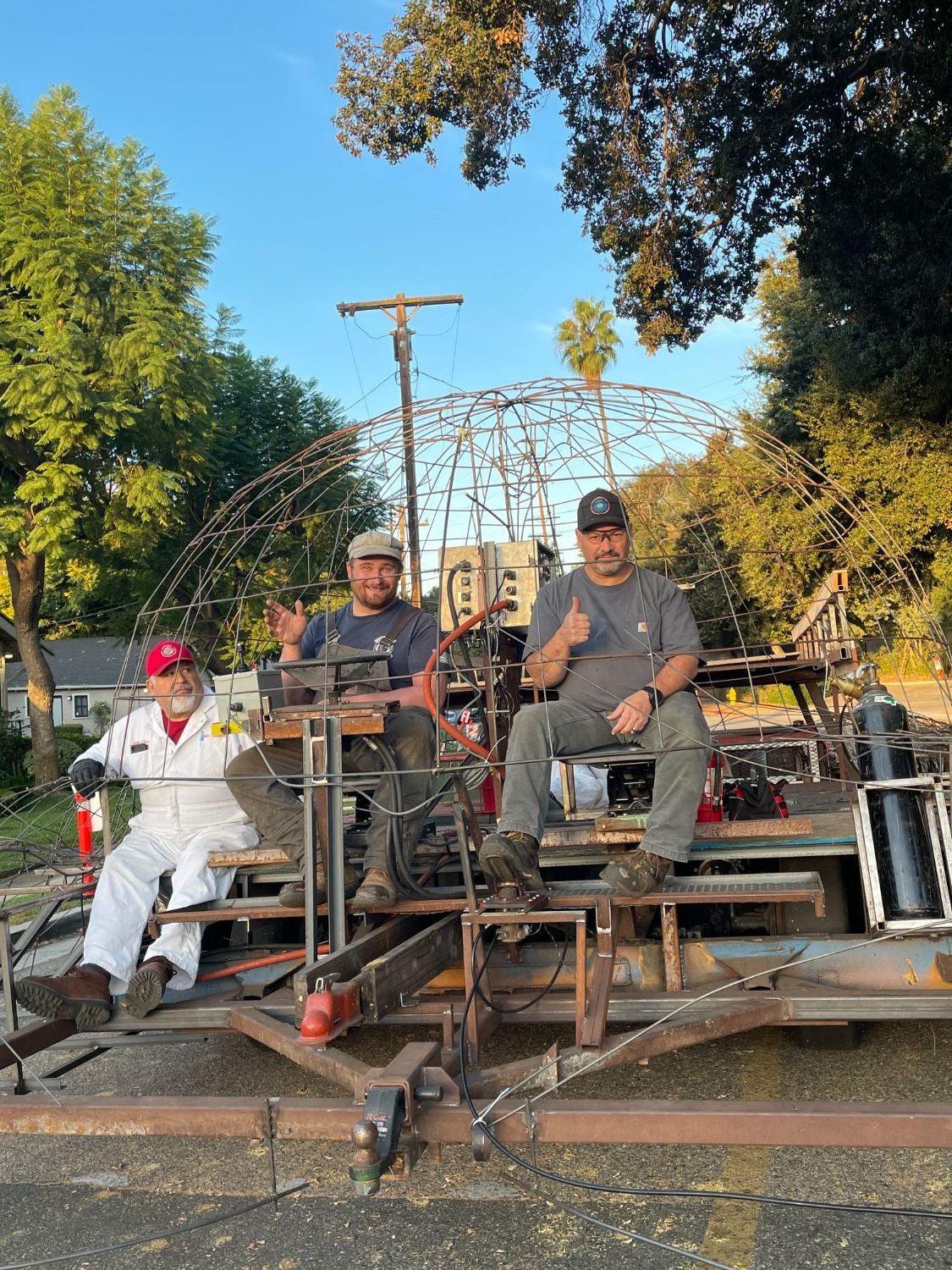 PHOTO: provided by SPTOR | The South Pasadenan | Two members of the float construction crew who will guide the float on January 1, 2025 with an inspector from the Tournament of Roses on board. Brandon Carlson (left) will drive the float and Rob Benjamin will animate it.