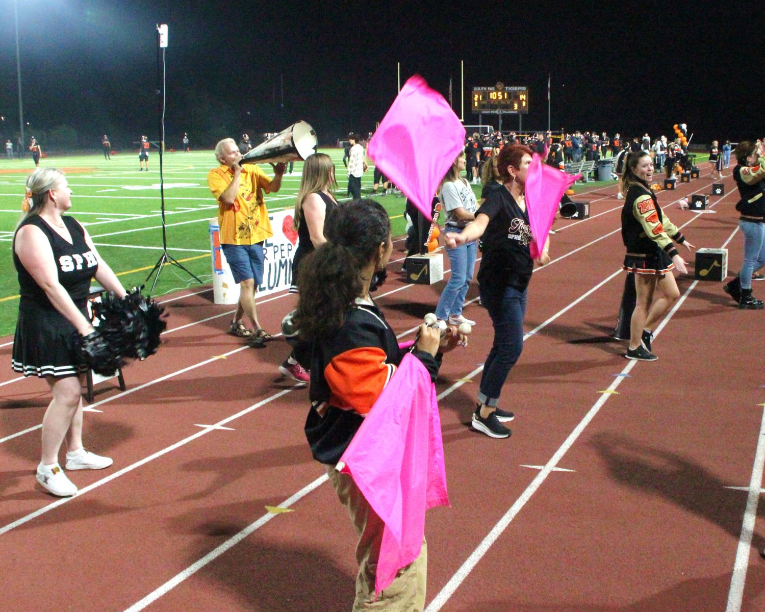 PHOTO: Henk Friezer | The South Pasadenan | Alumni join current SPHS cheerleaders on the field for Homecoming 2023.
