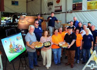 TWOHEY’S Brings Lunch to our South Pas Float Work Crew PHOTO: Henk Friezer | The South Pasadenan | Twohey’s Restaurant brings lunch to the South Pasadena Tournament of Roses’ Float work crew on Saturday, Oct. 21 at the float site at the War Memorial Building. Owners Tanya Christos (front, second from left) and Greg Mallis (front, wearing black shirt and holding platter) are providing complementary lunches for the crew during the float building and decoration season.