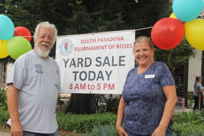 PHOTO: Sally Kilby | South Pasadenan News | Steve Fillingham and Janet Benjamin welcome customers to the South Pasadena Tournament of Roses’ yard sale at the War Memorial Building last August. The next sale will be Nov. 8-9. Community members can donate used items for the sale on Nov. 5-7. All proceeds go toward building and decorating the city’s self-built float that will ride down Colorado Boulevard Jan. 1 as part of the Pasadena Tournament of Roses Parade