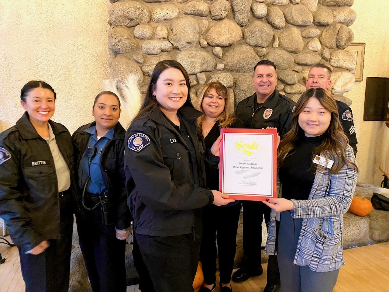 | The South Pasadenan | South Pasadena News PHOTO: Alisa Hayashida | The South Pasadenan | Thanksgiving celebration for South Pasadena seniors held at the War Memorial Building. South Pasadena Police Officers Foundation President, Rachell Lee accepts a certificate from Senator Portantino representative Erica Nam.