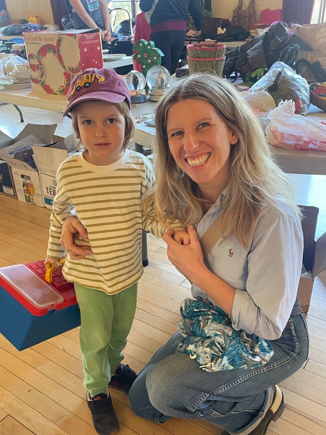 PHOTO: provided by SPTOR | South Pasadenan News | Mom Jeannine Haynes found a jacket at the SPTOR sale for son Julian McCarthy, who has picked out something for himself.
