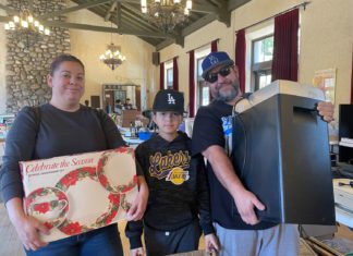 PHOTO: provided by SPTOR | South Pasadenan News | The Moreno Family finds dinnerware for the holidays and a shredder at the SPTOR sale.
