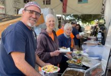 Hi-Life Burgers Serves Lunch to our Grateful Float Crew PHOTO: Sally Kilby | The South Pasadenan | Brant Dunlap, Mary Jane Juranek and Anita Scott take a break from working on the float to enjoy a taco salad lunch from Hi-Life.