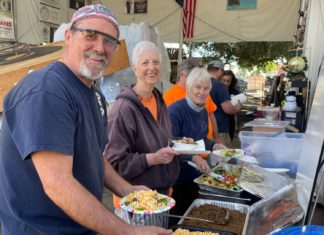 Hi-Life Burgers Serves Lunch to our Grateful Float Crew PHOTO: Sally Kilby | The South Pasadenan | Brant Dunlap, Mary Jane Juranek and Anita Scott take a break from working on the float to enjoy a taco salad lunch from Hi-Life.