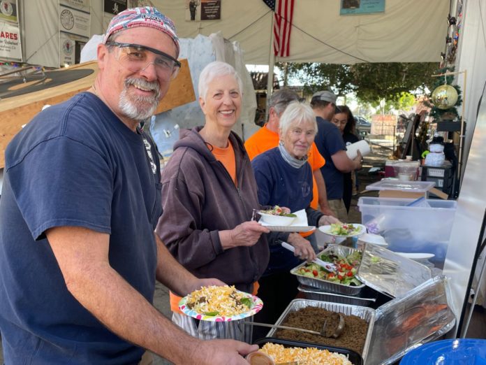 PHOTO: Sally Kilby | The South Pasadenan | Brant Dunlap, Mary Jane Juranek and Anita Scott take a break from working on the float to enjoy a taco salad lunch from Hi-Life.