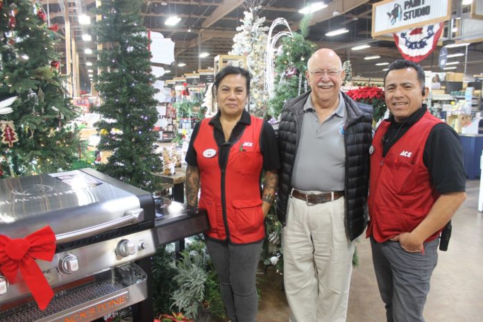 PHOTO: Sally Kilby | The South Pasadenan | One of the auction items featured in the Crunch Time Online Auction is a Blackstone 28" propane griddle donated to SPTOR by Westlake ACE South Pasadena. ACE manager Linda Rodriguez (left) and Manager Oscar Diaz (right) are pictured with Sam Hernandez, Tournament of Roses Association President, next to the BBQ.