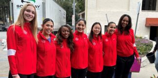 PHOTO: Bill Glazier | The South Pasadenan | The Tournament of Roses Queen and Court gather in front of flowers that arrived this week before being placed on South Pasadena’s float – “Boogie Fever” – in time for Monday’s Rose Parade in Pasadena.
