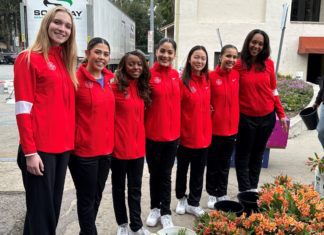 2024 Queen and Rose Court Visit South Pasadena Float Site PHOTO: Bill Glazier | The South Pasadenan | The Tournament of Roses Queen and Court gather in front of flowers that arrived this week before being placed on South Pasadena’s float – “Boogie Fever” – in time for Monday’s Rose Parade in Pasadena.