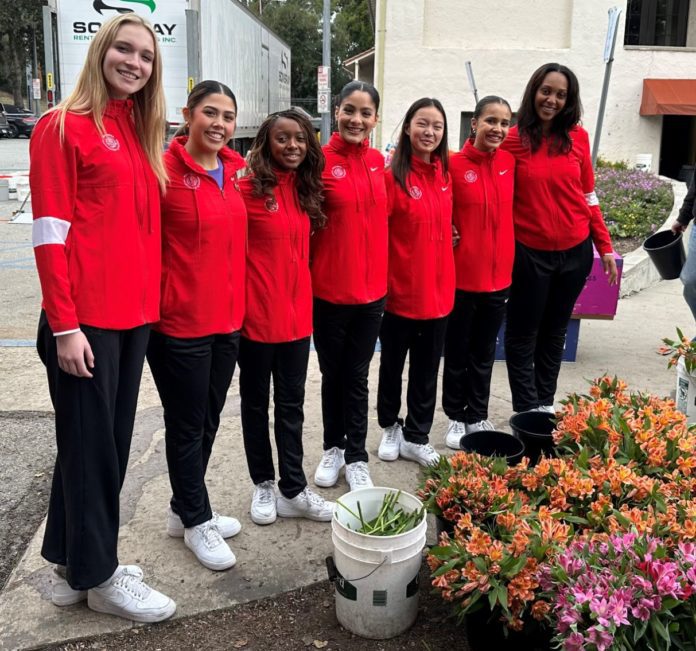 PHOTO: Bill Glazier | The South Pasadenan | The Tournament of Roses Queen and Court gather in front of flowers that arrived this week before being placed on South Pasadena’s float – “Boogie Fever” – in time for Monday’s Rose Parade in Pasadena.