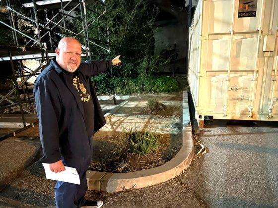 PHOTO: Bill Glazier | The South Pasadenan | Ed&nbsp; Donnelly, chair of the South Pasadena Tournament of Roses, points to an area behind the War Memorial Building where a permanent building is projected to someday house the city&rsquo;s float. Over the years, the float has been constructed in a giant circus-like tent at the site.