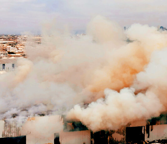 PHOTO: LAFD | The EPA and LA County Health HazMat are currently on scene monitoring the perimeter of the building fire for air toxics.