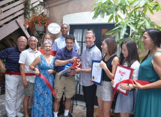 Bungalow 1026 Holds Festive Ribbon Cutting in Tranquil Courtyard